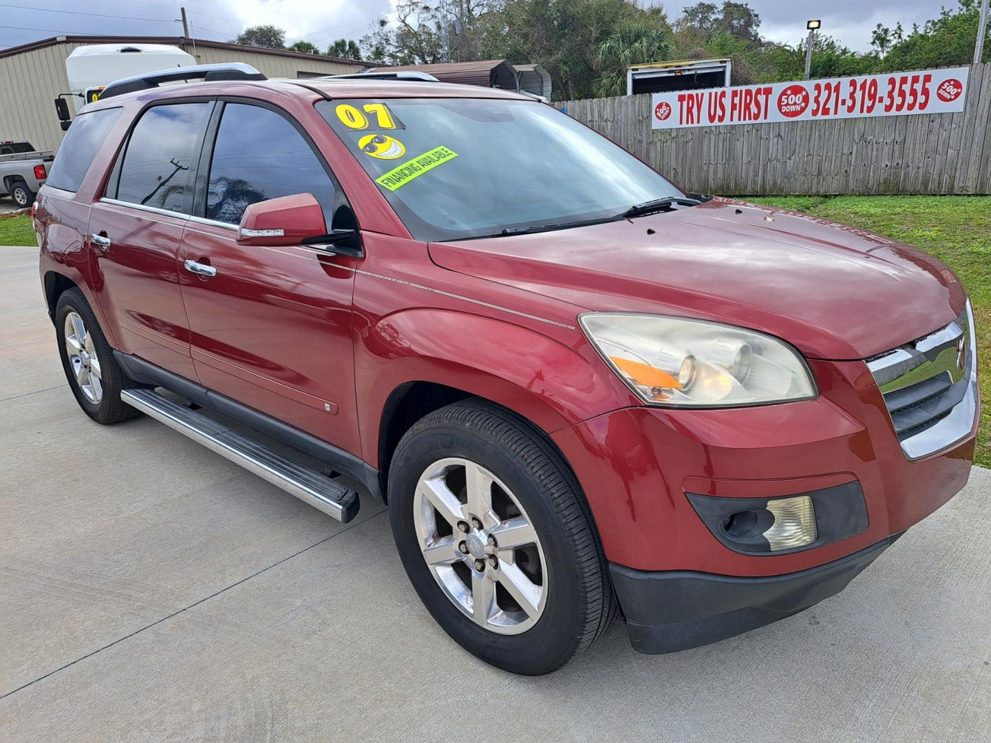 2008 RED Saturn Outlook XR FWD (5GZER33758J) with an 3.6L V6 DOHC 24V engine, Automatic transmission, located at 1181 Aurora Rd, Melbourne, FL, 32935, (321) 241-1100, 28.132914, -80.639175 - Photo#2