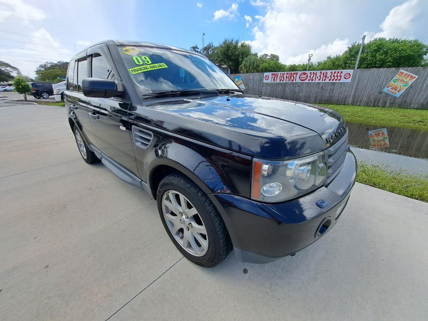 2009 Black Land Rover Range Rover Sport HSE (SALSK25489A) with an 4.4L V8 DOHC 32V engine, 6-Speed Automatic Overdrive transmission, located at 1181 Aurora Rd, Melbourne, FL, 32935, (321) 241-1100, 28.132914, -80.639175 - Photo#1