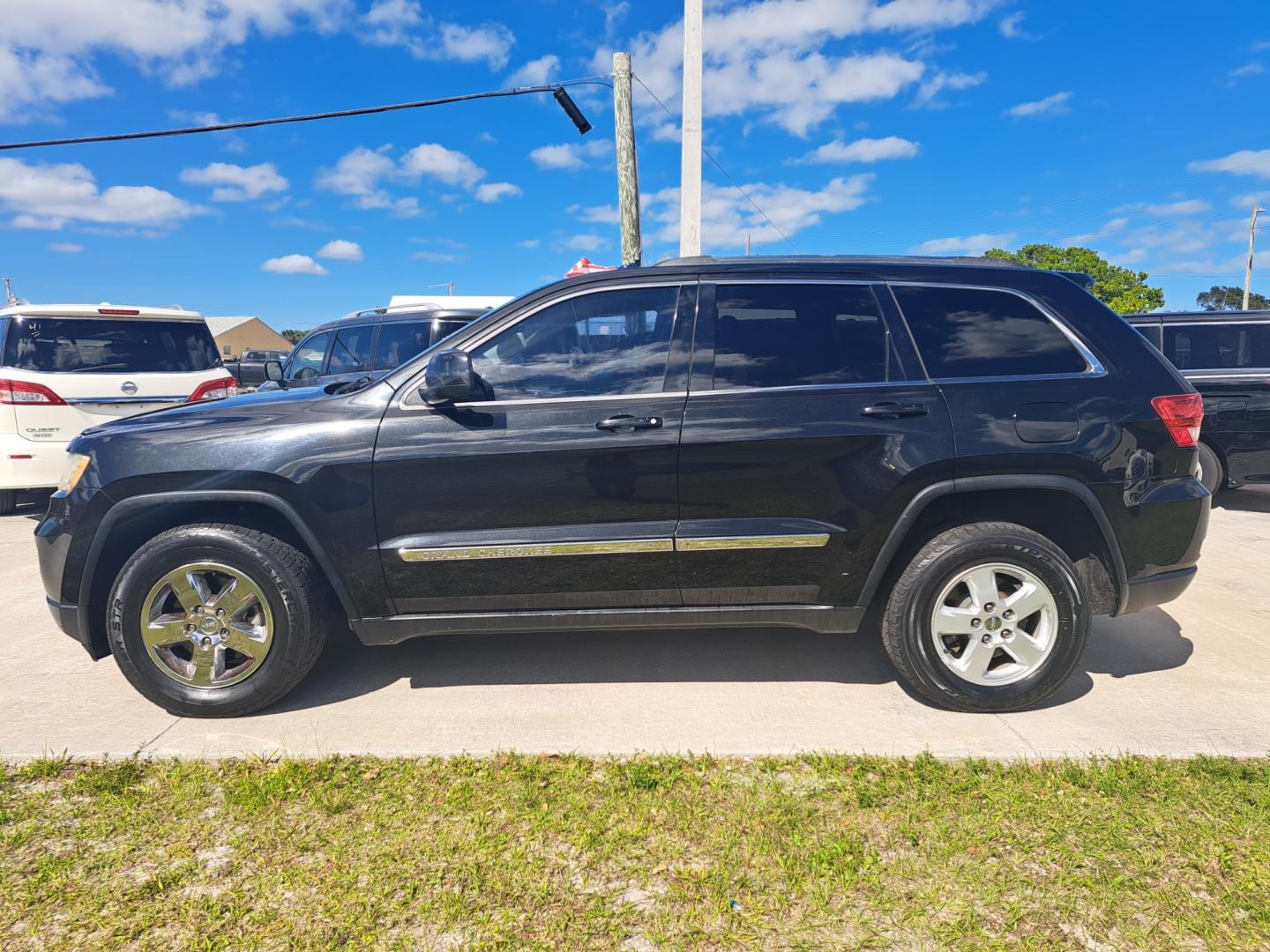 2013 Black Jeep Grand Cherokee Laredo 2WD (1C4RJEAG4DC) with an 3.6L V6 DOHC 24V engine, 5-Speed Automatic transmission, located at 1181 Aurora Rd, Melbourne, FL, 32935, (321) 241-1100, 28.132914, -80.639175 - Photo#0