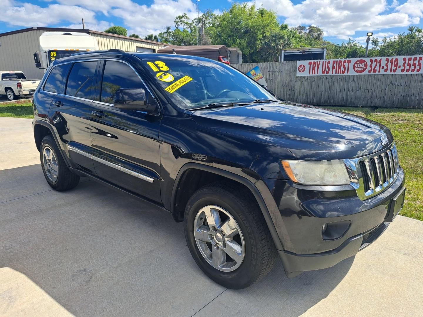 2013 Black Jeep Grand Cherokee Laredo 2WD (1C4RJEAG4DC) with an 3.6L V6 DOHC 24V engine, 5-Speed Automatic transmission, located at 1181 Aurora Rd, Melbourne, FL, 32935, (321) 241-1100, 28.132914, -80.639175 - Photo#1