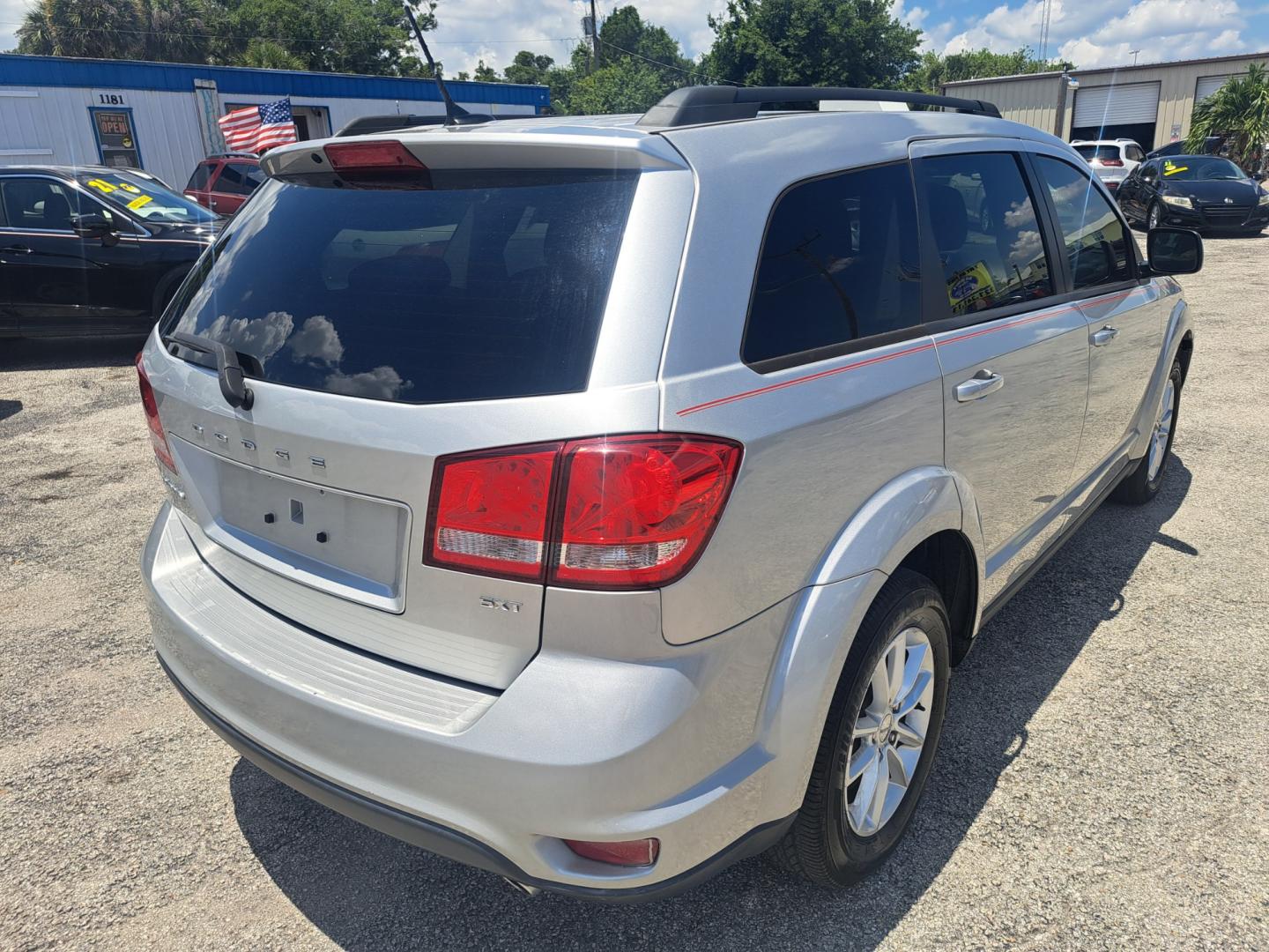 2013 Silver Dodge Journey SXT (3C4PDCBG4DT) with an 3.6L V6 DOHC 24V engine, 6-Speed Automatic transmission, located at 1181 Aurora Rd, Melbourne, FL, 32935, (321) 241-1100, 28.132914, -80.639175 - Photo#1