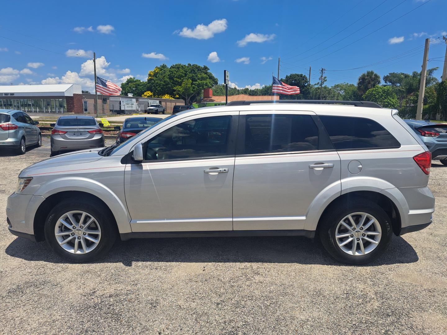 2013 Silver Dodge Journey SXT (3C4PDCBG4DT) with an 3.6L V6 DOHC 24V engine, 6-Speed Automatic transmission, located at 1181 Aurora Rd, Melbourne, FL, 32935, (321) 241-1100, 28.132914, -80.639175 - Photo#0